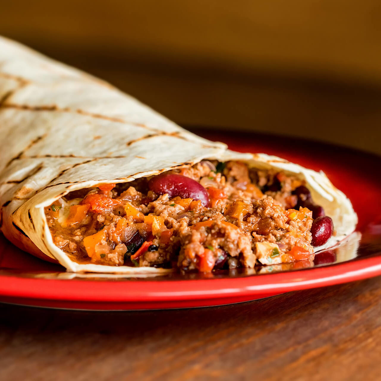 delicious-burrito-with-minced-meat-on-plate